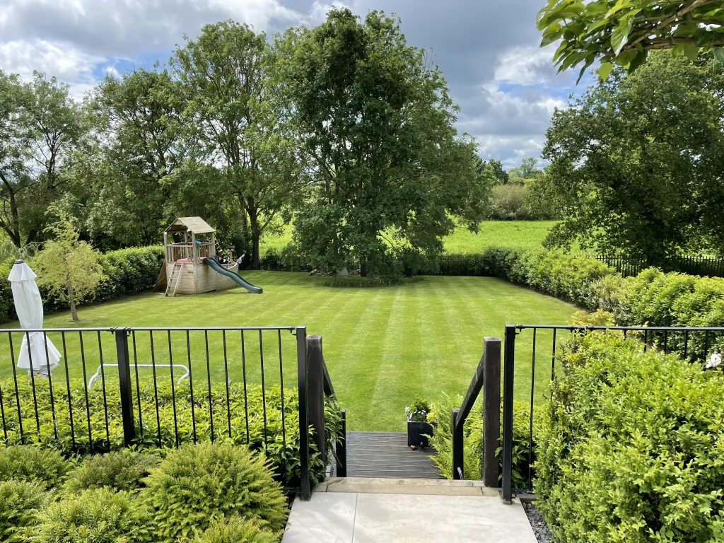 New lawn with metal railings and steps